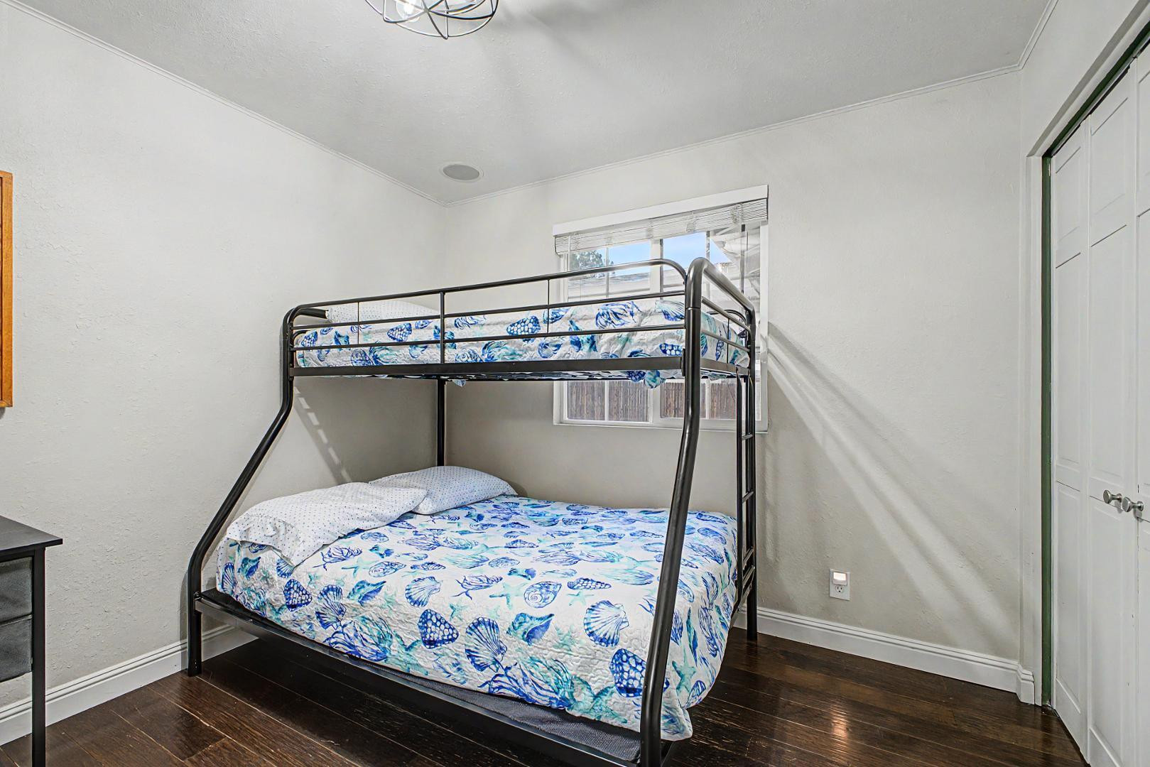 3346 East Cochise Road Phoenix, AZ 85028 - Photo 30 of 40 a bedroom with a bed and wooden floor