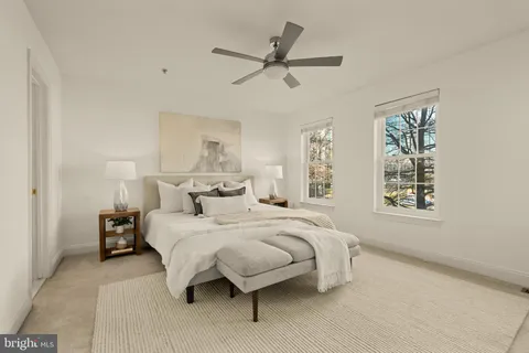 a bedroom with a bed and window