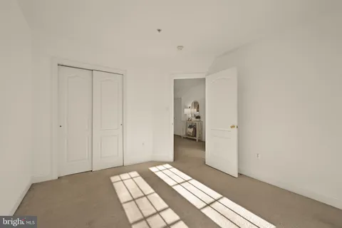 a view of a bedroom with closet