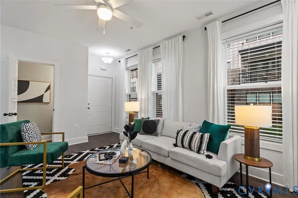 a living room with furniture and a large window