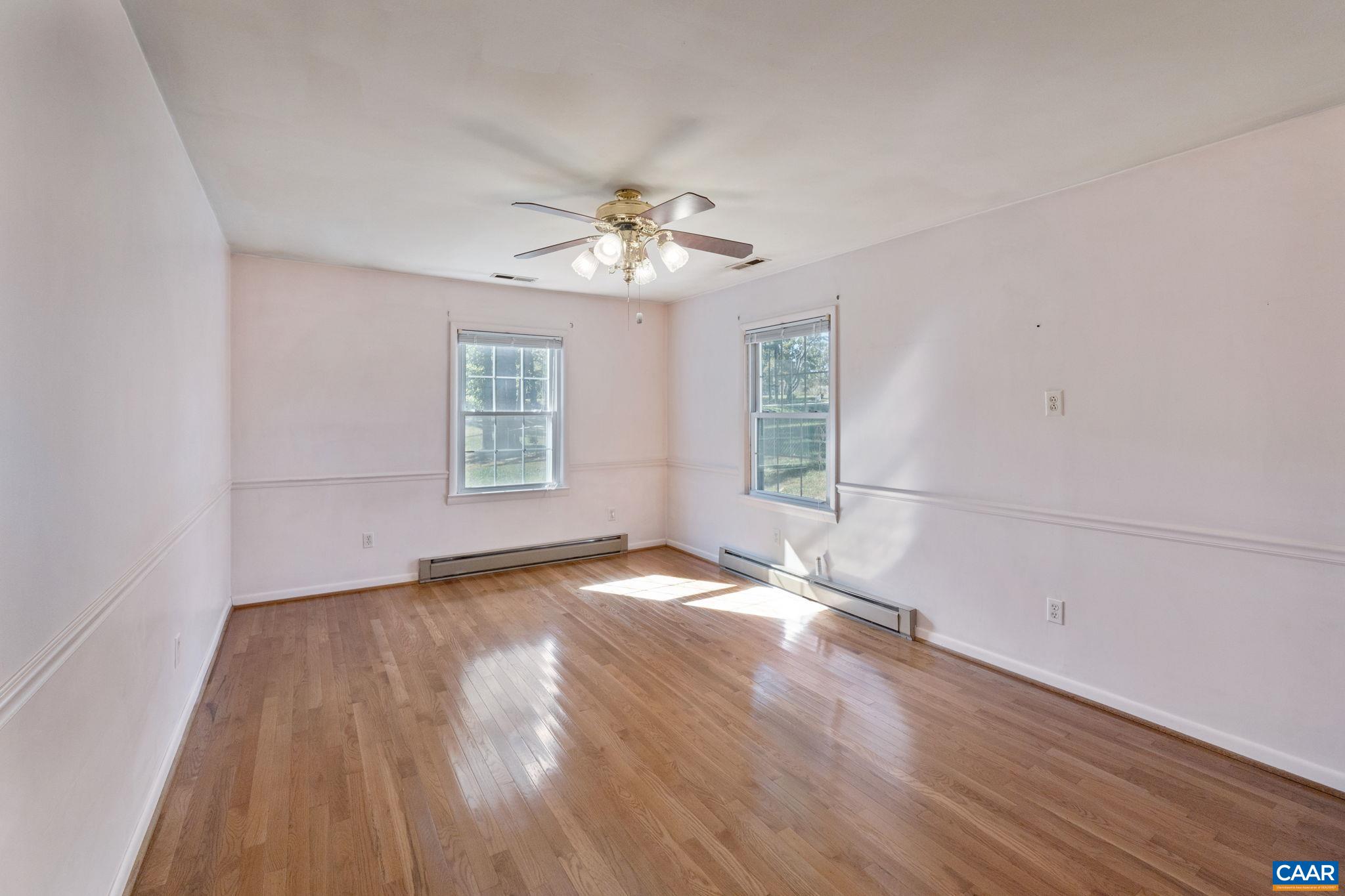 2380 South Constitution Route Dillwyn, VA 23936 - Photo 19 of 41 a view of empty room with wooden floor and fan