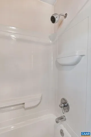 a bathroom with a shower and a bathtub