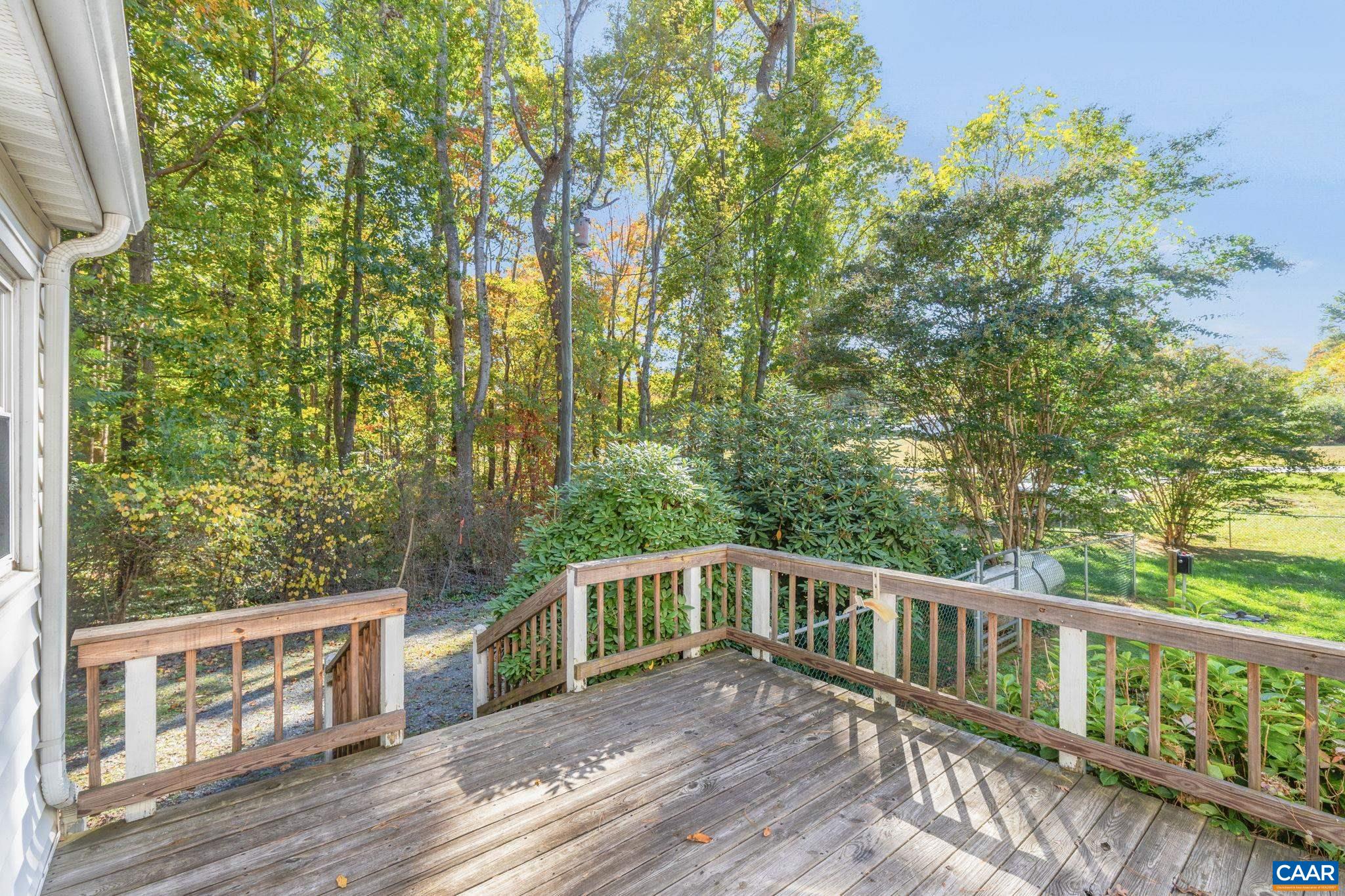 2380 South Constitution Route Dillwyn, VA 23936 - Photo 24 of 41 a balcony with wooden floor and yard in the back