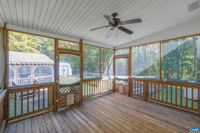 a view of a porch with wooden floor