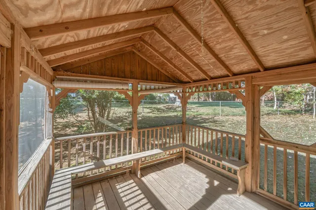 a view of a balcony with wooden floor