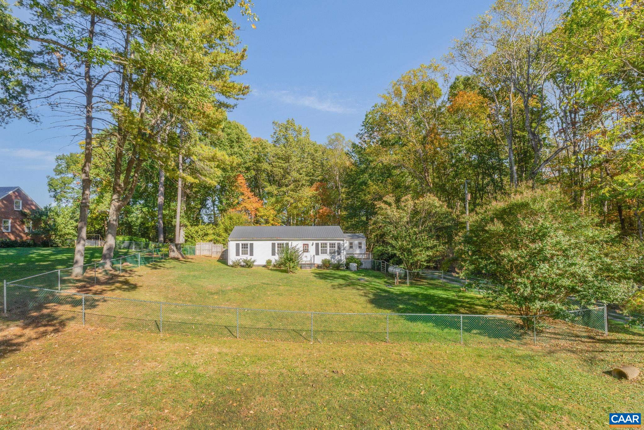 2380 South Constitution Route Dillwyn, VA 23936 - Photo 41 of 41 a view of a swimming pool with a yard and large trees