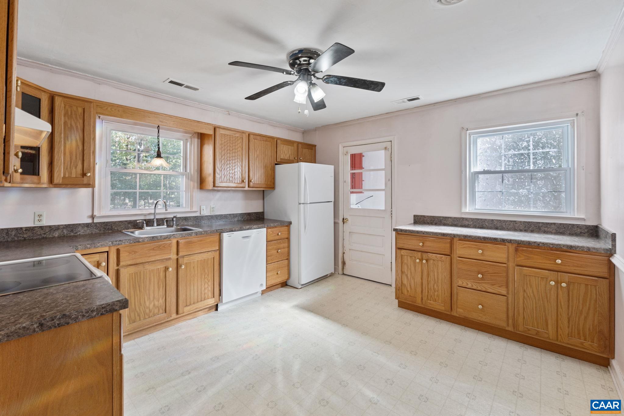 2380 South Constitution Route Dillwyn, VA 23936 - Photo 6 of 41 a kitchen with granite countertop a sink stainless steel appliances and window