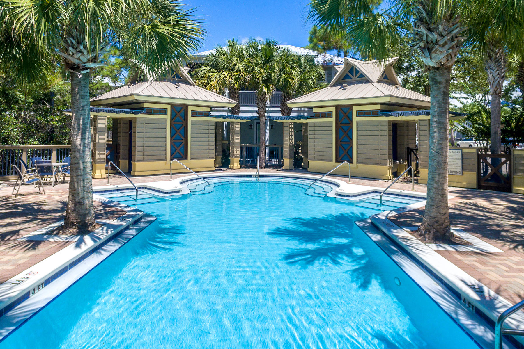 Lot 16 Eastern Lake Santa Rosa Beach, FL 32459 - Photo 22 of 23 a patio with a table and chairs under an umbrella