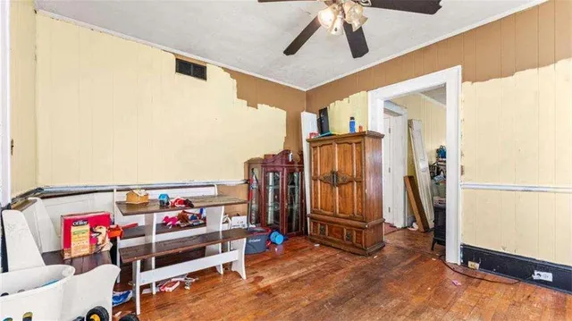 a view of a hallway with workspace and windows