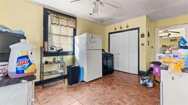 a view of play room with toys and windows