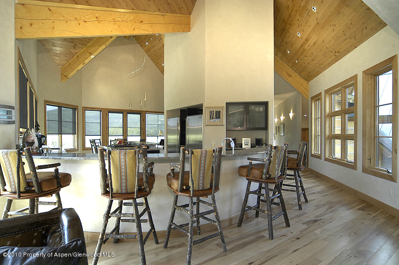 805 Sopris Mountain Ranch Road Basalt, CO 81621 - Photo 12 of 23 a view of a dining room with furniture and wooden floor