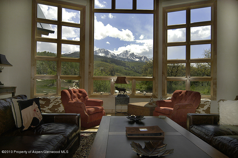 805 Sopris Mountain Ranch Road Basalt, CO 81621 - Photo 18 of 23 a living room with furniture and a floor to ceiling window