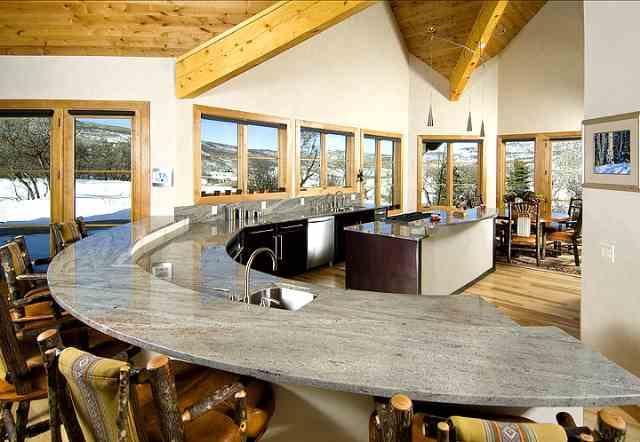 805 Sopris Mountain Ranch Road Basalt, CO 81621 - Photo 4 of 23 a view of a dining room with furniture large windows and wooden floor