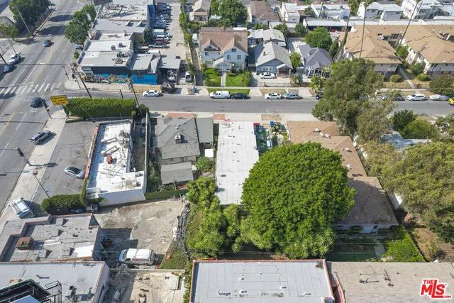 an aerial view of residential houses with outdoor space