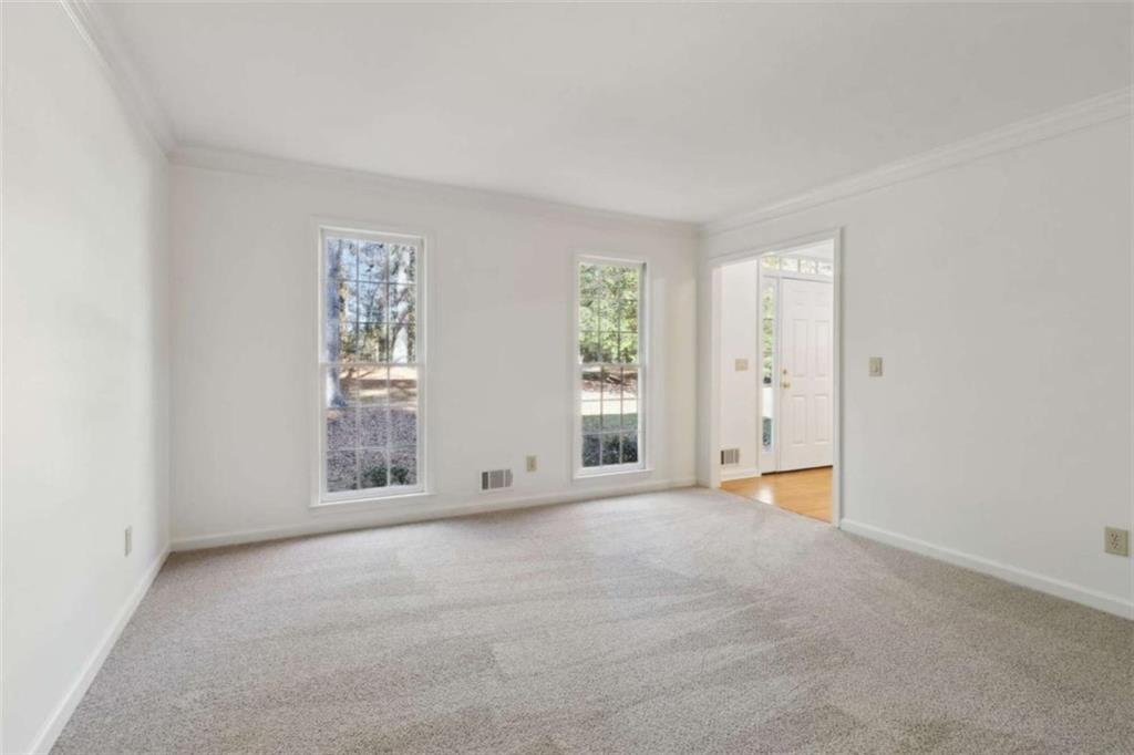 3083 Callie Still Road Lawrenceville, GA 30045 - Photo 12 of 73 an empty room with windows