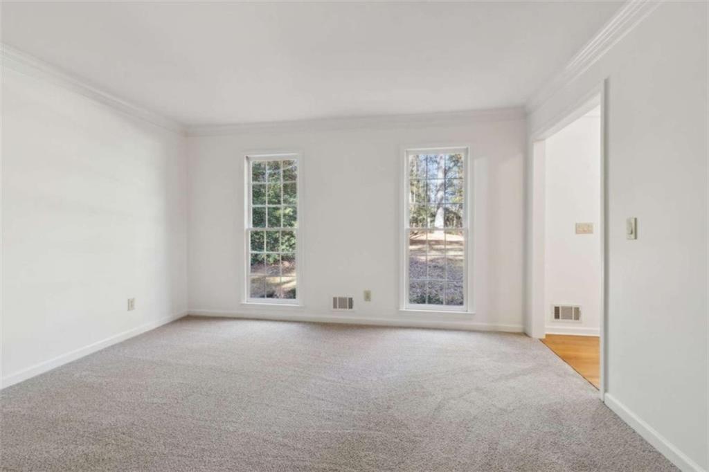3083 Callie Still Road Lawrenceville, GA 30045 - Photo 13 of 73 an empty room with windows