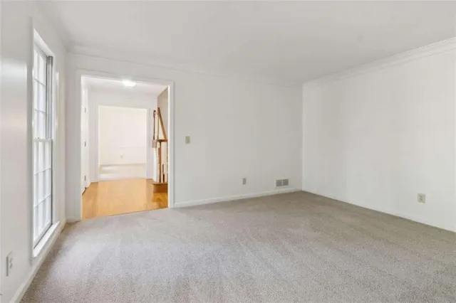 a view of an empty room with a window