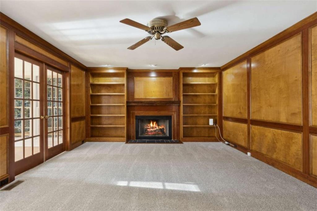 3083 Callie Still Road Lawrenceville, GA 30045 - Photo 17 of 73 a view of an empty room with a fireplace and a window
