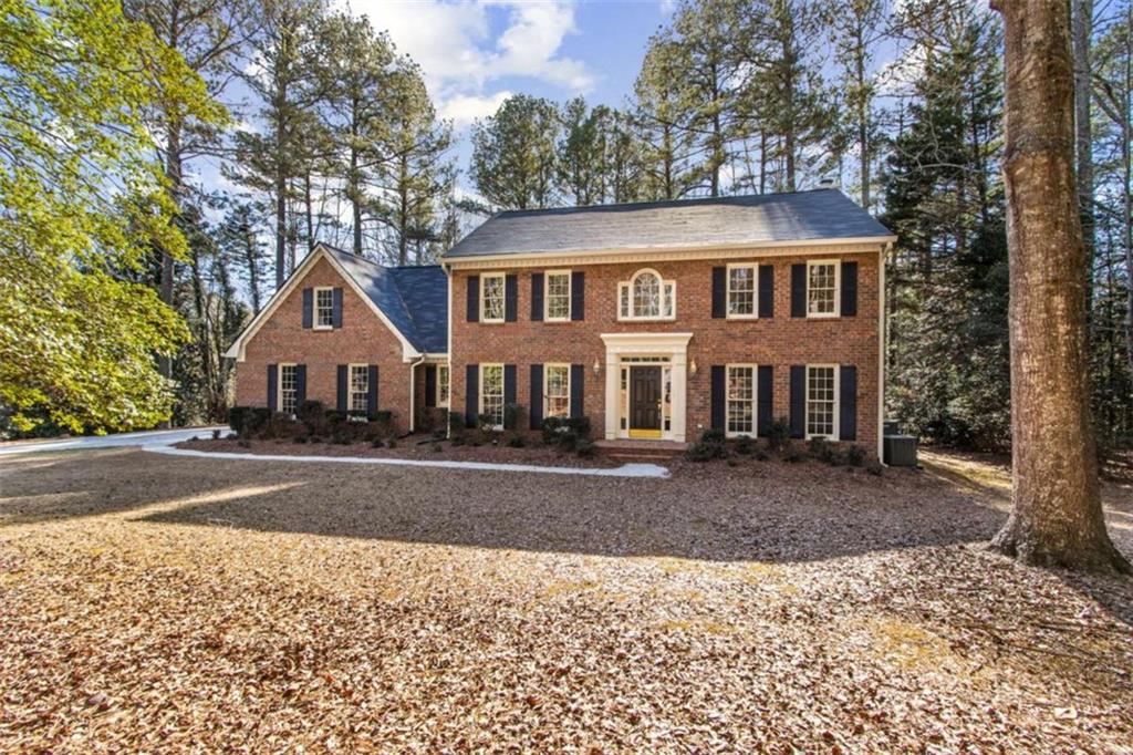 3083 Callie Still Road Lawrenceville, GA 30045 - Photo 2 of 73 a front view of a house with a yard and garage