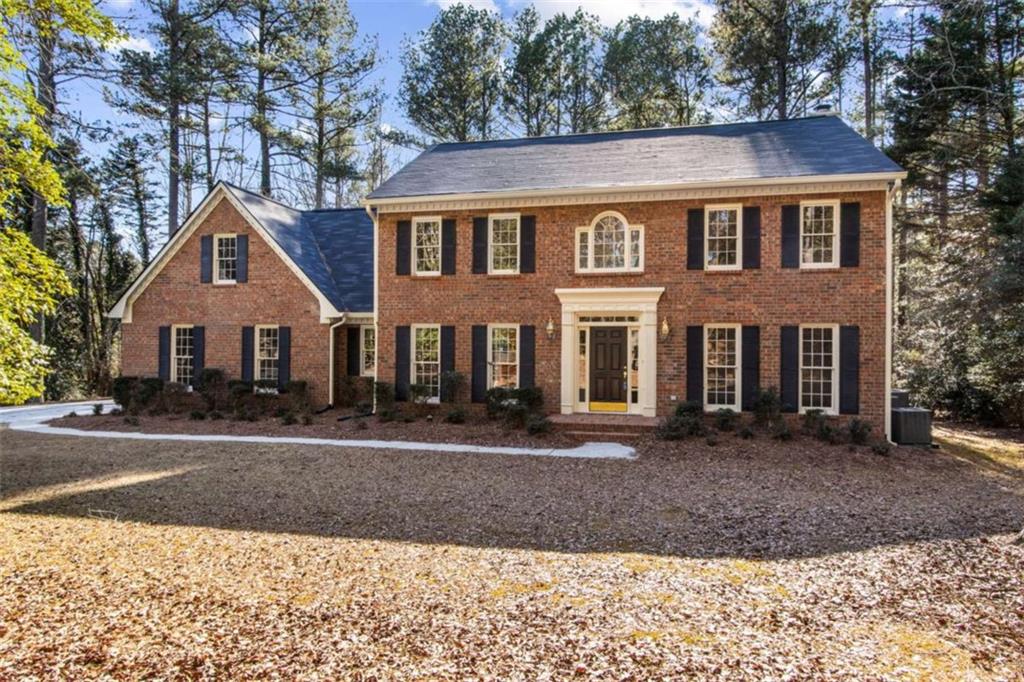 3083 Callie Still Road Lawrenceville, GA 30045 - Photo 3 of 73 a front view of a house with a yard
