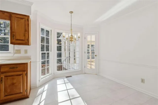 a view of an entryway with wooden floor and a front door