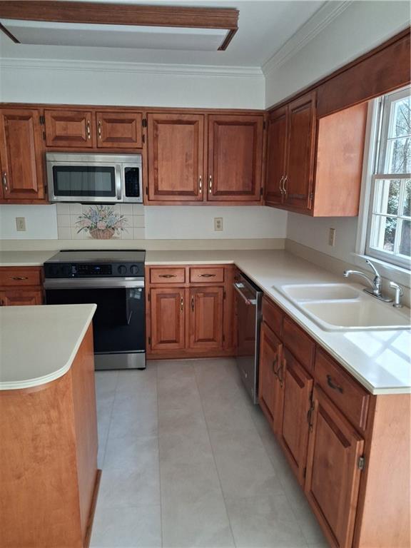 3083 Callie Still Road Lawrenceville, GA 30045 - Photo 33 of 73 a kitchen with stainless steel appliances granite countertop a sink stove and microwave