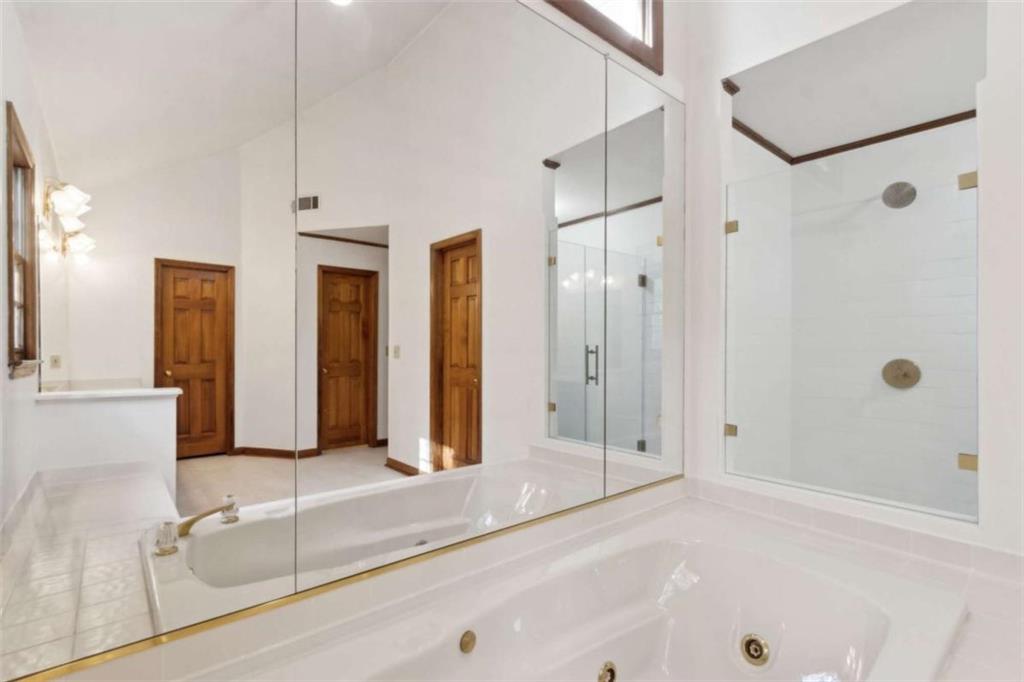 3083 Callie Still Road Lawrenceville, GA 30045 - Photo 43 of 73 a bathroom with a tub shower and sink