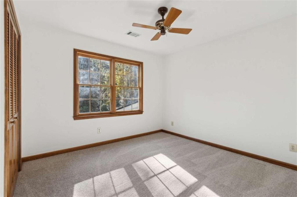 3083 Callie Still Road Lawrenceville, GA 30045 - Photo 49 of 73 an empty room with a window