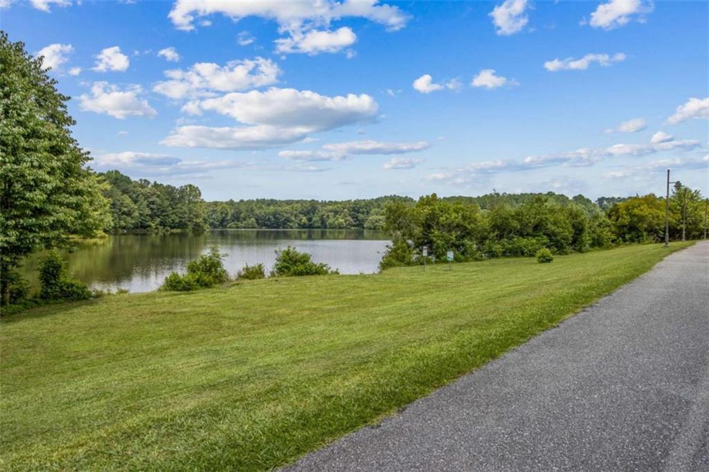3083 Callie Still Road Lawrenceville, GA 30045 - Photo 63 of 73 a view of a lake with a city
