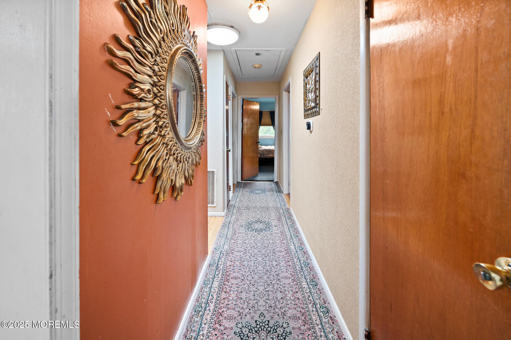 117 Greymoor Road Howell, NJ 07731 - Photo 14 of 32 a view of a hallway with wooden floor and a door