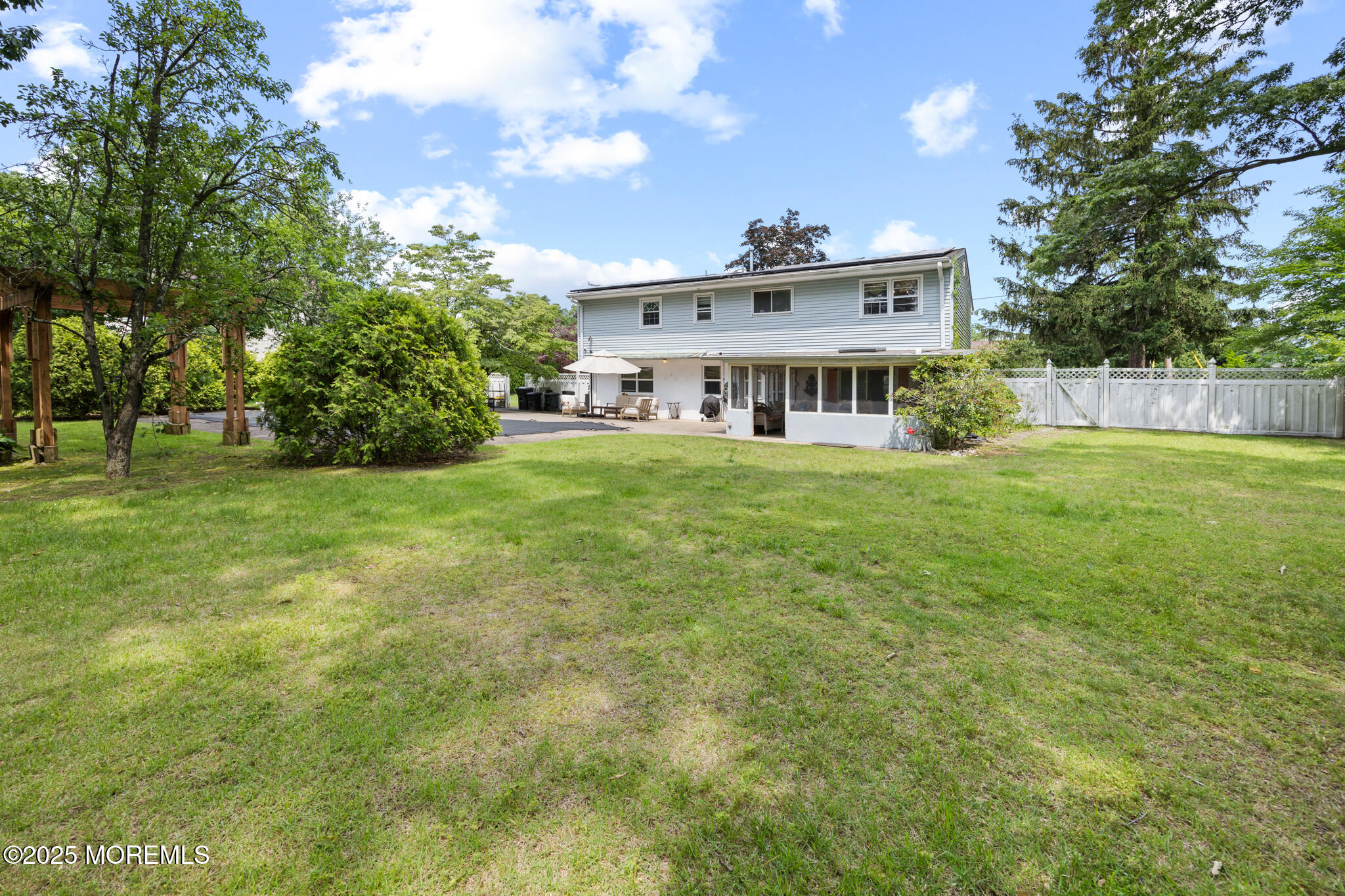 117 Greymoor Road Howell, NJ 07731 - Photo 28 of 32 a view of a house with a big yard and large trees