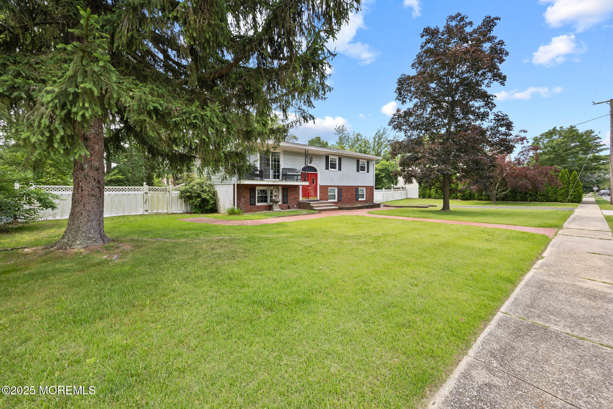 117 Greymoor Road Howell, NJ 07731 - Photo 3 of 32 a view of a house with a big yard and large trees