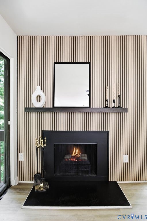 10270 Iron Mill Road Richmond, VA 23235 - Photo 16 of 29 Floor-to-ceiling accent wall featuring vertical wo