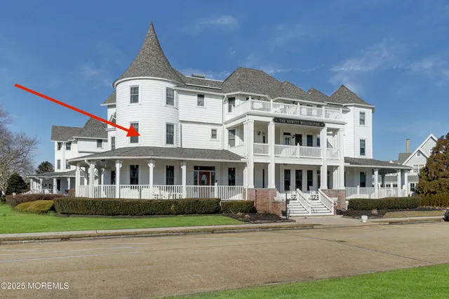a front view of a residential houses with yard