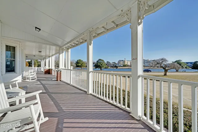 a view of a balcony with wooden floor