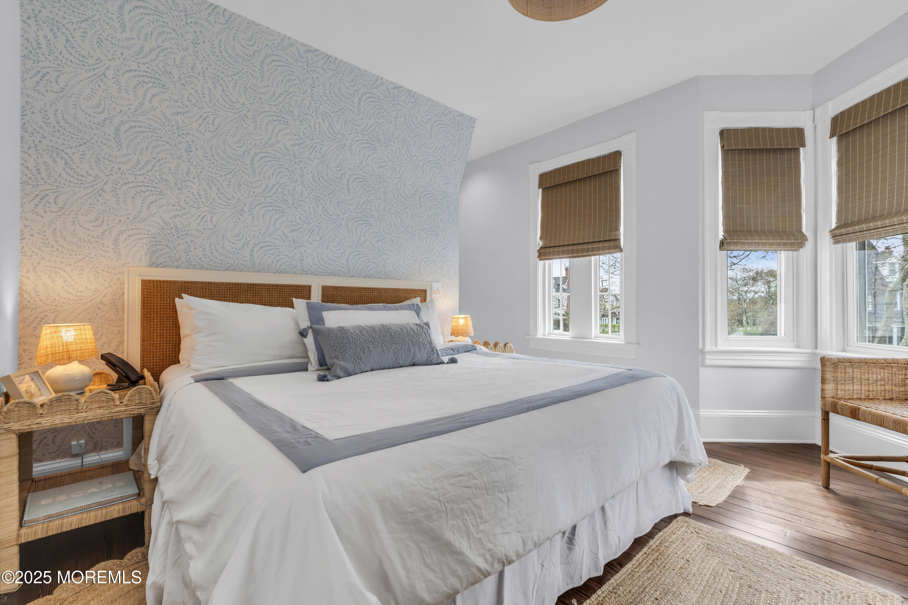 200 Monmouth Avenue, Unit 5 Spring Lake, NJ 07762 - Photo 8 of 26 a bedroom with a bed a chair and next to a window