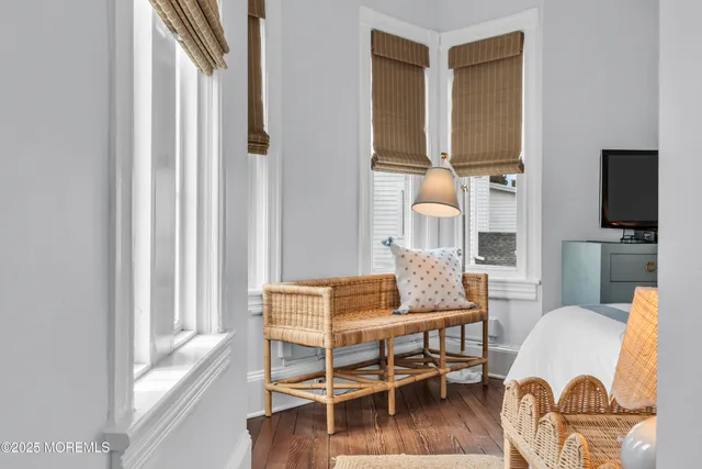 a dining room with furniture and wooden floor