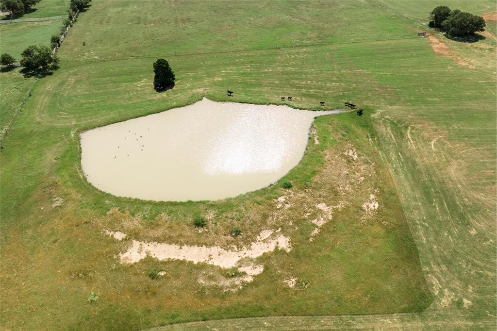 5200 Cross Timbers Road Flower Mound, TX 75028 - Photo 8 of 17 a view of a swimming pool with a yard