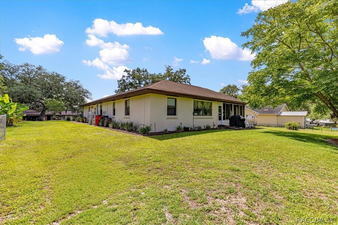 2964 South Cygnet Terrace Inverness, FL 34450 - Photo 50 of 67 a front view of a house with yard and lake view