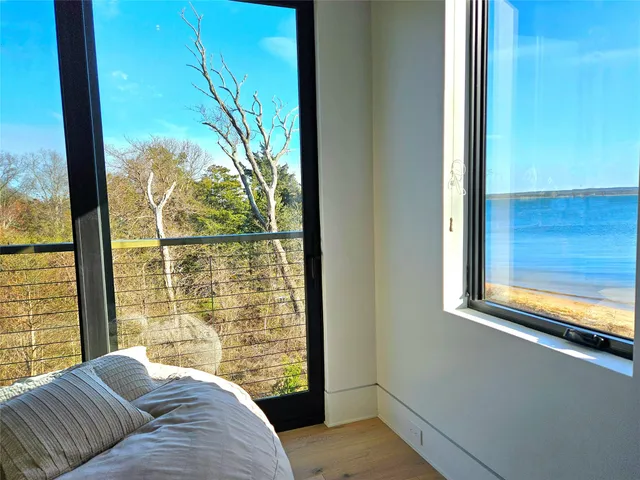 a view of a wooden deck with a yard