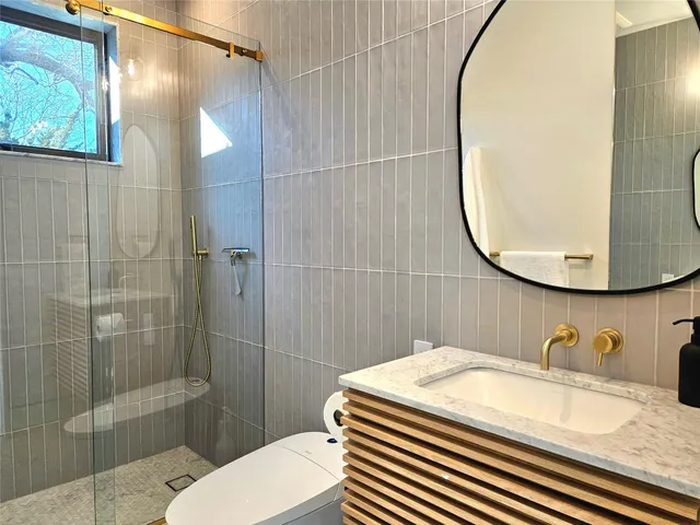 a view of a chair and table in the patio with a yard