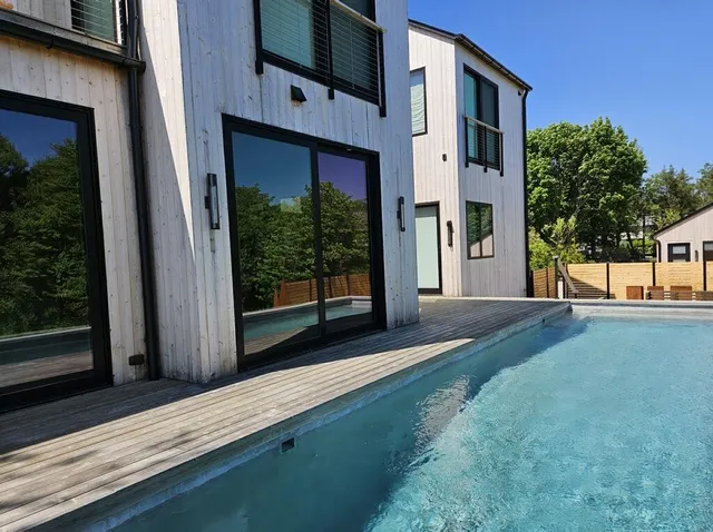 a front view of a house with a yard