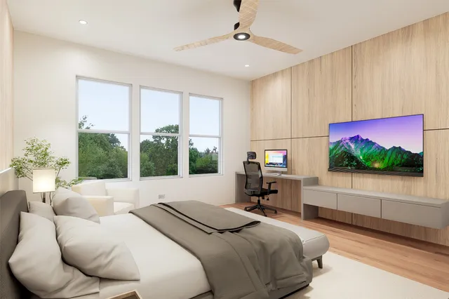 a bedroom with bed and a large window