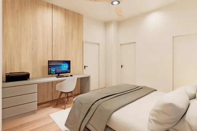 a bedroom with a bed and a night stand