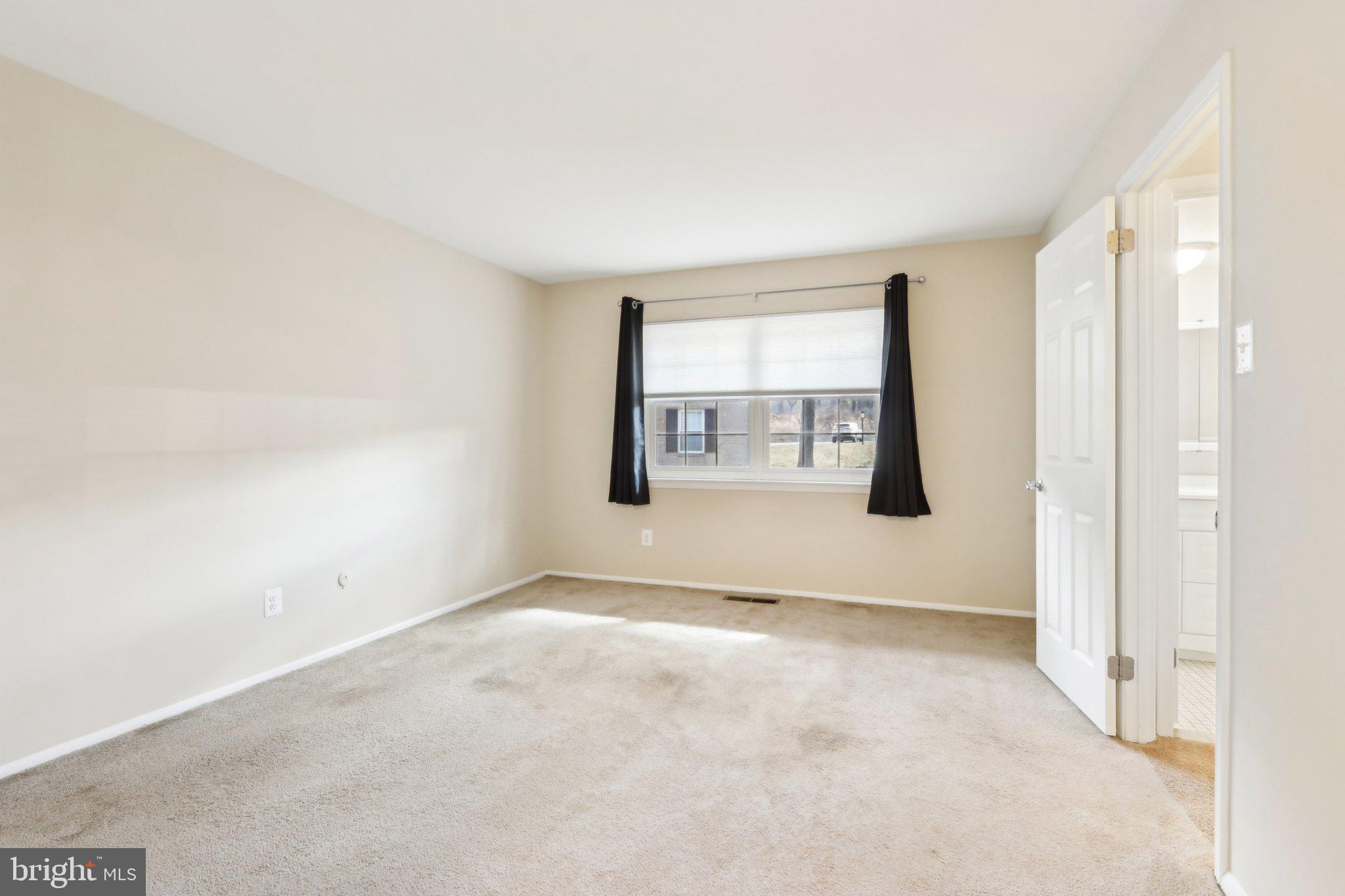 467 Old Forge Crossing Devon, PA 19333 - Photo 16 of 34 an empty room with windows and mirror