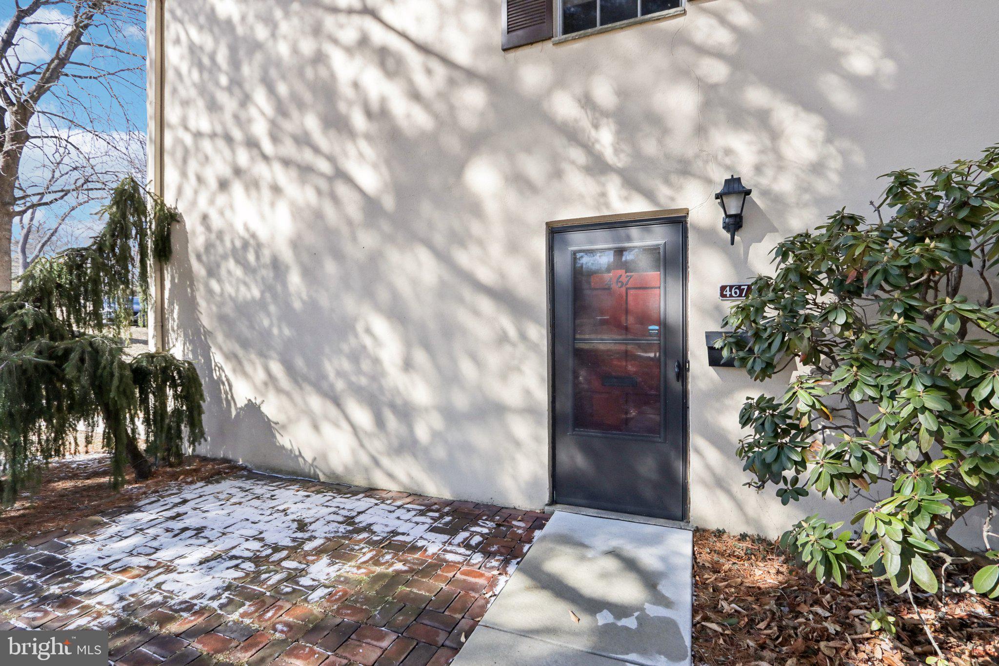 467 Old Forge Crossing Devon, PA 19333 - Photo 3 of 34 a view of a wooden door and a yard