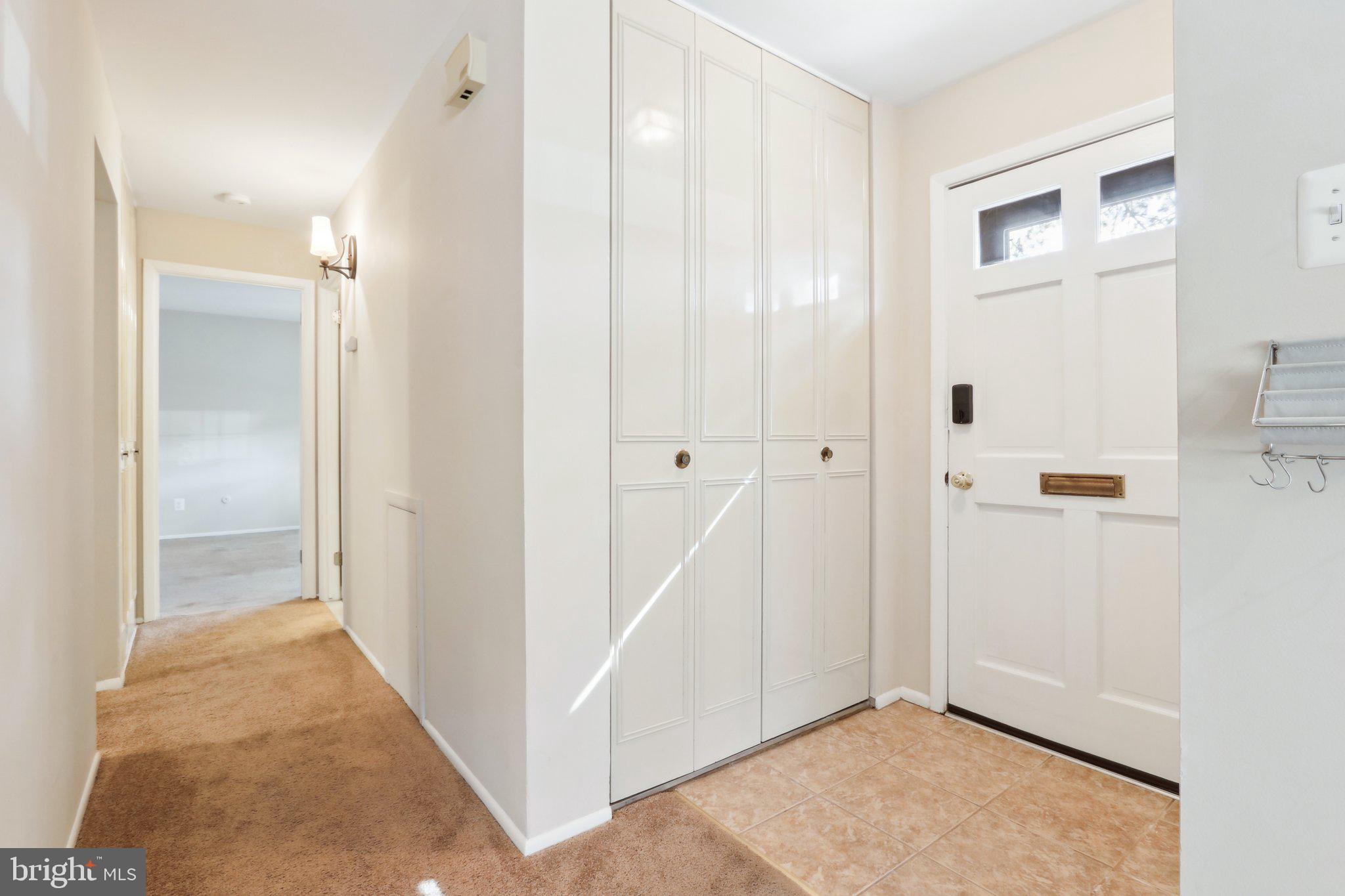 467 Old Forge Crossing Devon, PA 19333 - Photo 5 of 34 a view of a hallway with wooden floor and closet area