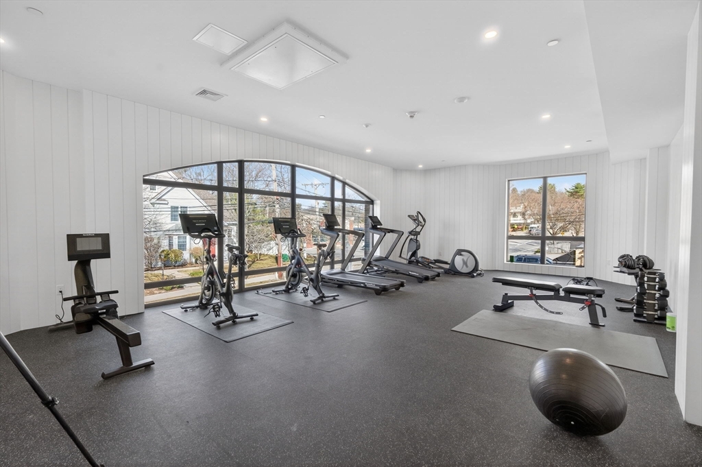 1114 Beacon Street, Unit 101 Newton, MA 02461 - Photo 21 of 29 a view of a room with gym equipment