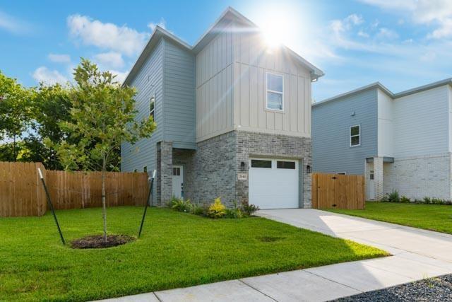 a view of a backyard with potted plants and a large tree