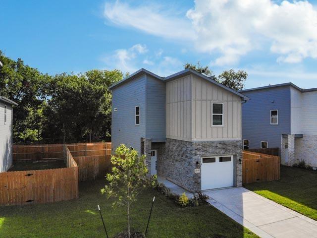 2642 Sutton Street Dallas, TX 75210 - Photo 2 of 12 a balcony with table and chairs